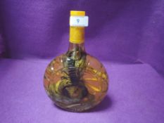 A bottled Cobra and scorpion in herb water,possibly Asian, for ornamental purposes only!