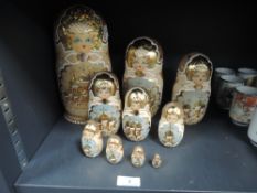 A set of ten Matryoshka dolls having hand painted design with gilt detailing.