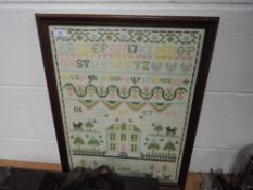 A framed cross stitch sampler worked by E Wier 1992, depicting animals,house,alphabet and more.