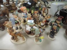 a collection of Goebel figurines and similar.