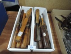 A selection of wood or cabinet makers various shape carving turning and bevel edge chisels