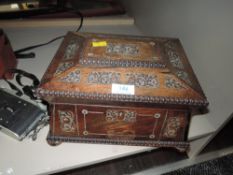 An early 20th century jewellery box, inlaid with mother of pearl and having compartmental tray to