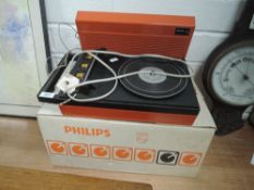 A vintage tangerine orange record player by Philips with box