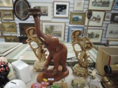 Two oriental style lamp bases and a wooden elephant lamp base.