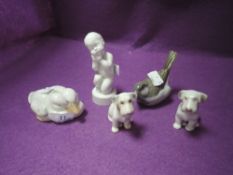 A collection of royal Copenhagen and similar figures,including dogs,ducks and more.