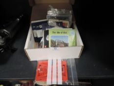 An assortment of Viewmaster slides and similar including Isle of Man,moon landing and Devon