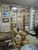 Three brass table lamps of traditional style.