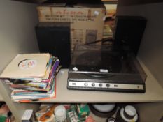 A Goodmans melody maker record players,speakers and a selection of 45rpm singles.