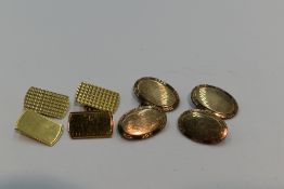 A pair of 9ct gold cufflinks having chequered decoration and chain connectors, and an oval pair of