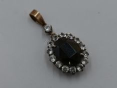 A Victorian green and white gem stone cluster pendant, possibly central green sapphire within a