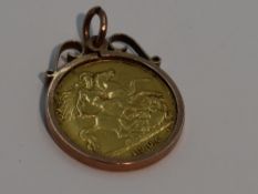 A 1906 gold half sovereign in a yellow metal removable pendant mount stamped 9ct