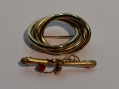 A yellow metal triple oval brooch stamped 375 and a small yellow metal bar brooch stamped 9ct