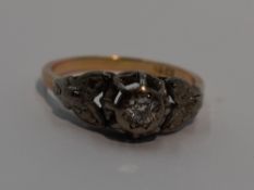 A lady's dress ring having a diamond solitaire, approx 0.25ct in an illusionary white metal mount to