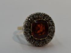 A lady's dress ring having a diamond and spinel style stone cluster, diamonds total approx 0.7ct, in