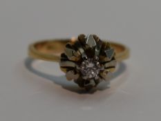 A lady's dress ring having a diamond solitaire, approx 0.128ct in a stylised white and yellow
