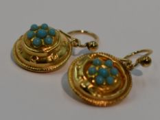 A pair of 9ct gold drop loop earrings of circular form having turquoise decoration