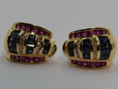 A pair of yellow metal stud earrings stamped 14K having clip butterflies and set with three rows