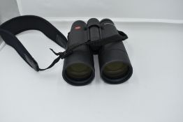 A pair of Leica 'Ultravid' 10 x 50 binoculars, No.1553583, with instruction book and Leica lens