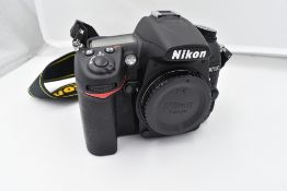 A Nikon camera with lens and equipment in a hard Peli 1600 case. A Nikon D700 body, a Nikon AF-S