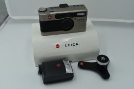 A Leica Minilux Compact Camera, titanium, serial no. 2145366, with Leitz Summarit f/2.4 40mm lens.