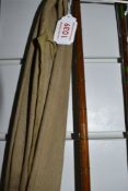 A vintage 12ft cane rod with spare tip in sleeve, unmarked