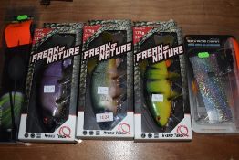 An assortment of large fishing gear including freak of nature and savage gear.