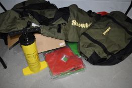 A Snowbee float tube kit unused, including pump and flippers.