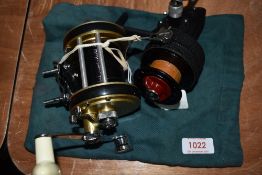 A Dam quick finessa vintage lightweight spinning reel and Policansky monitor no 2 multiplier reel.