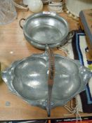 Two arts and crafts style pewter bowls one traditional twin handled by Roundhead and a Liberty