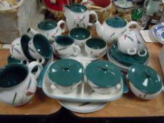 A collection of Denby including teapots,jugs,plates,tureens and more around twenty nine items.
