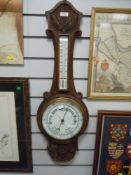 A vintage carved oak bodied barometer with enamel face dial glass AF
