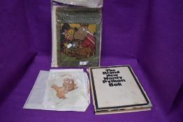 A vintage Monty python book, a vintage French childrens book and two vintage Lawson Wood prints.