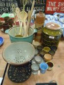 A selection of vintage kitchen wares including green glaze Hornsea pottery jar trivet and utensils