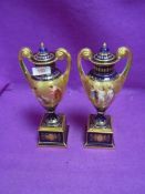 A pair of highly decorated mantle urns bearing Royal Vienna beehive stamp to base hand painted to