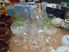 A selection of clear cut and crystal glass wares including green sundae dishes
