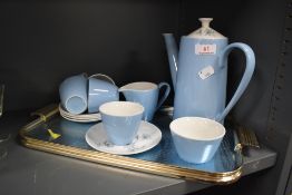 A mid century Johnson Bros blue and white partial coffee set having floral accents with similarly