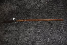 A small tribal spear having wood shaft with wrought iron tip measuring 104 cm long possibly from the