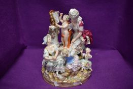 An impressive and substantial figure base depicting mythological and religious imagery of Cupid