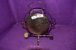 A small plated gong.