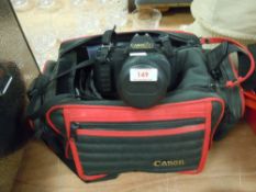 A Canon T80 camera with bag and flash.