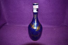 A Devon Fieldings Lustre vase having gold flora and bird decoration