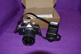 A Pentax ME super camera with a Sigma UC zoom 28-70mm lens and sunpak flash.