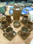 A retro Surrey ceramics partial coffee service, having paisley pattern, five cups with square