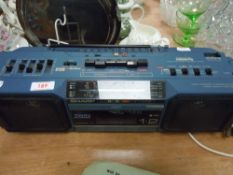 A Sharp stereo radio cassette recorder with twin mechanism.