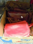 A selection of vintage leather and similar hand bags including bright red