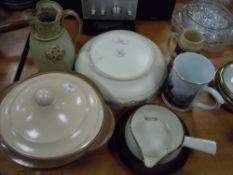 A selection of ceramics including Poole bowl Tremar style jug and train mug