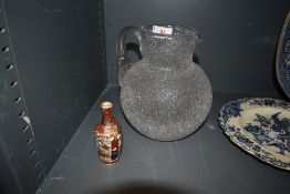 A Fosted glass water jug and a small oriental styled vase.