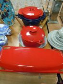 A selection of cast and enamel Creuset style cooking pans and dishes