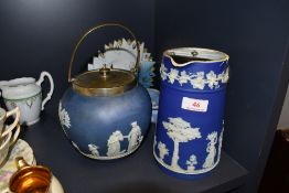 A Wedgwood biscuit barrel and a lidded jug, also included is a small trinket dish.