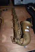 A vintage brass saxophone stamped THIBOUVILE-LAMY, LONDON/PARIS, CONDITION REPORT - lost its sheen